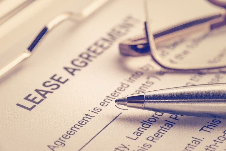 Close-up of a pen and glasses on a lease agreement
AI-generated content may be incorrect.